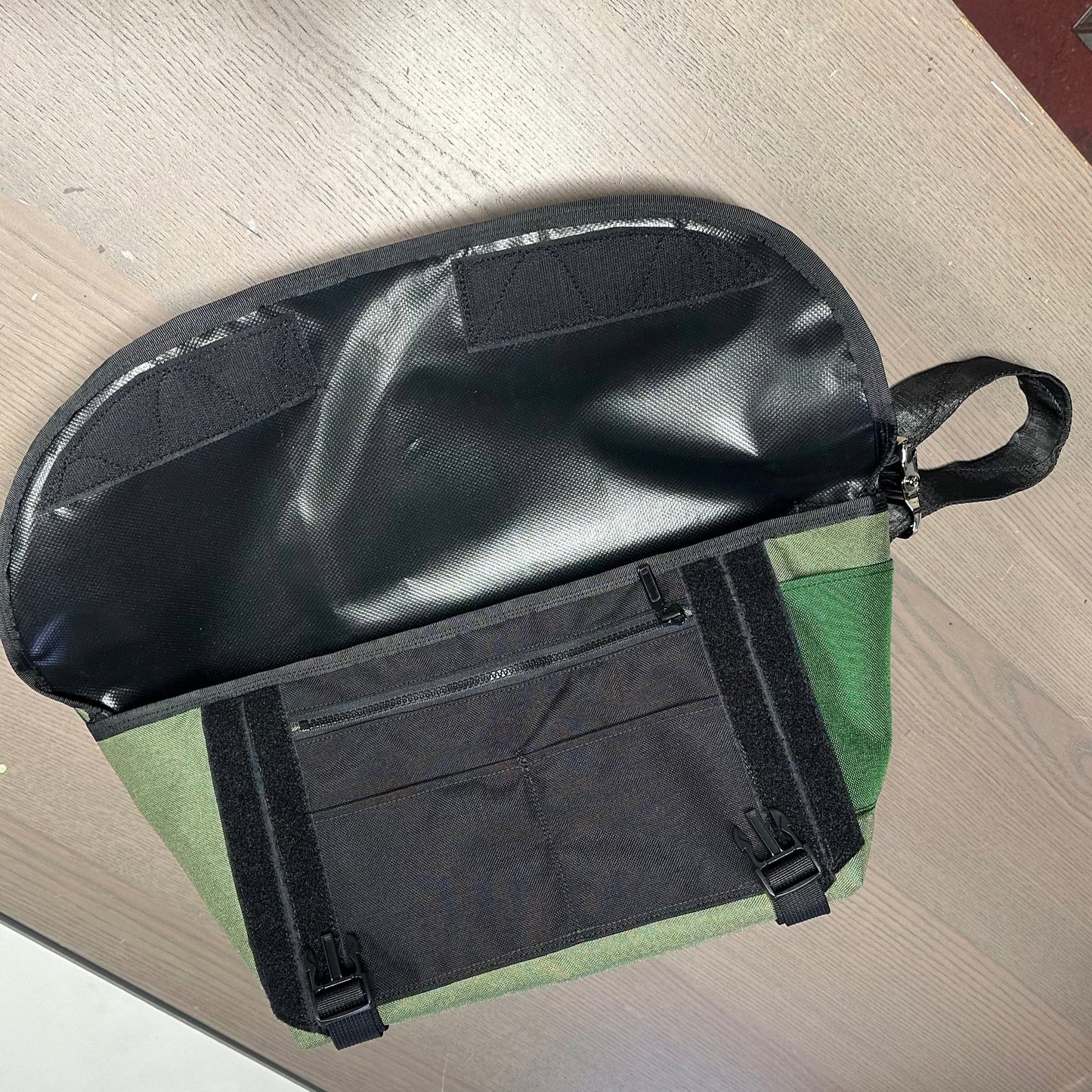 Wide small olive sling bag