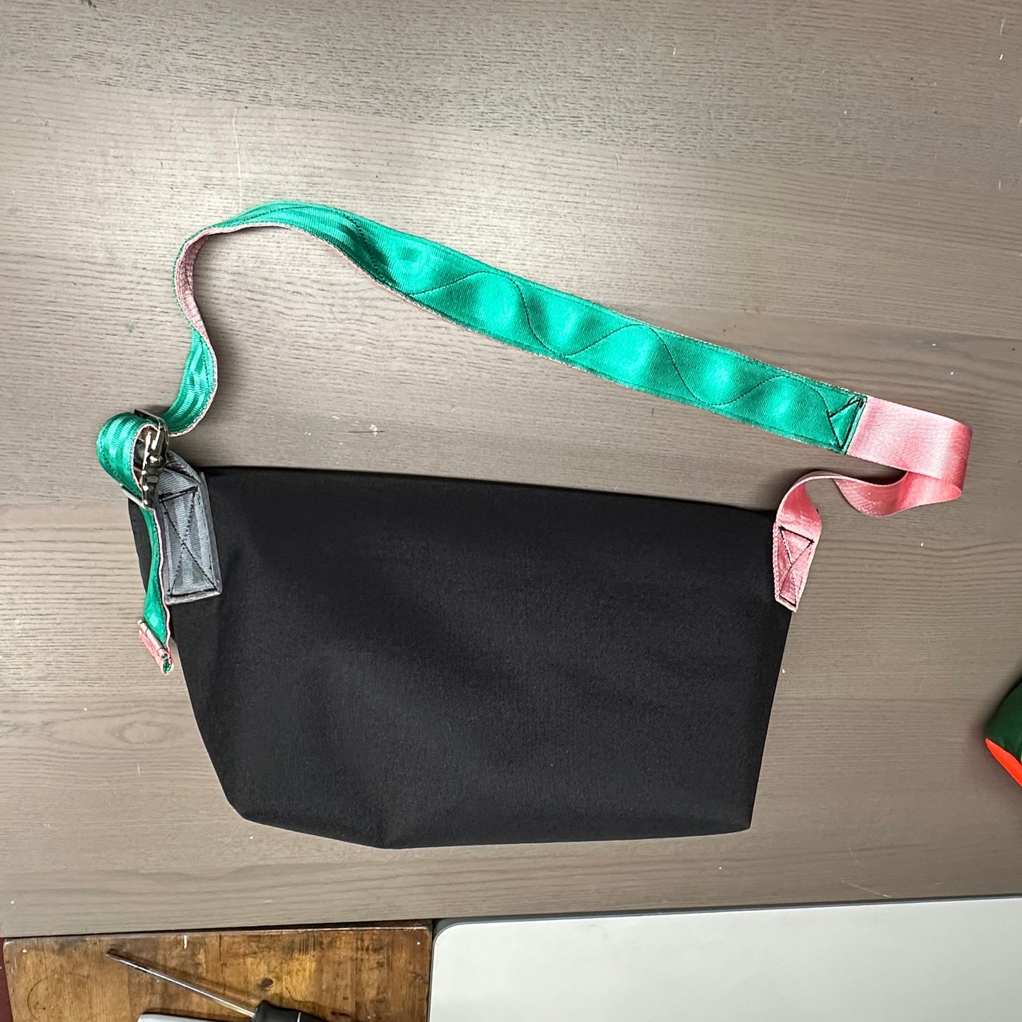 Wider small sling bag in black